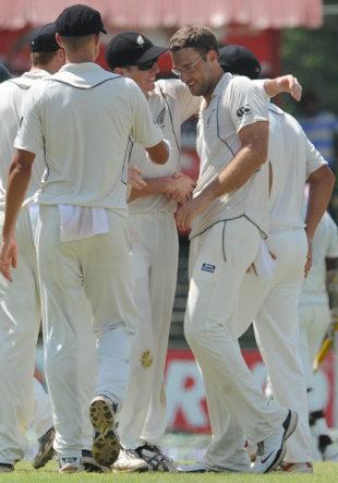 Daniel Vettori being congratulated by his team mates on reaching 300 test wickets