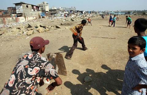 Kids playing cricket in India